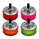 Peleninė sukama 12 cm – stiklo ir metalo derinys. Raudona, rožinė, oranžinė, žalia. Patogus paspaudimo mechanizmas.