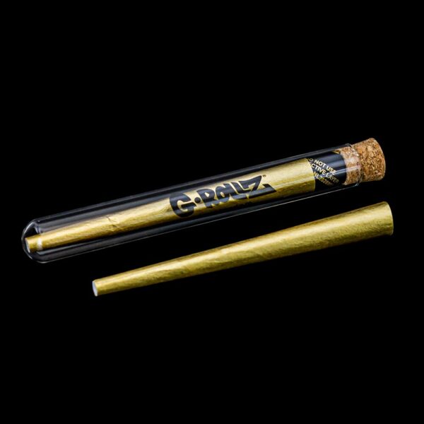 Iš anksto susuktas G-Rollz 24K Gold Cone auksinis popierėlis šalia apsauginio dėklo su kamštiniu uždarymu